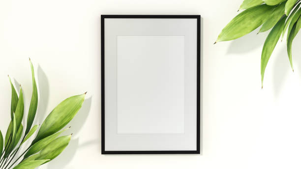 istock Picture frame mounted on the wall with flower vase 1438804029