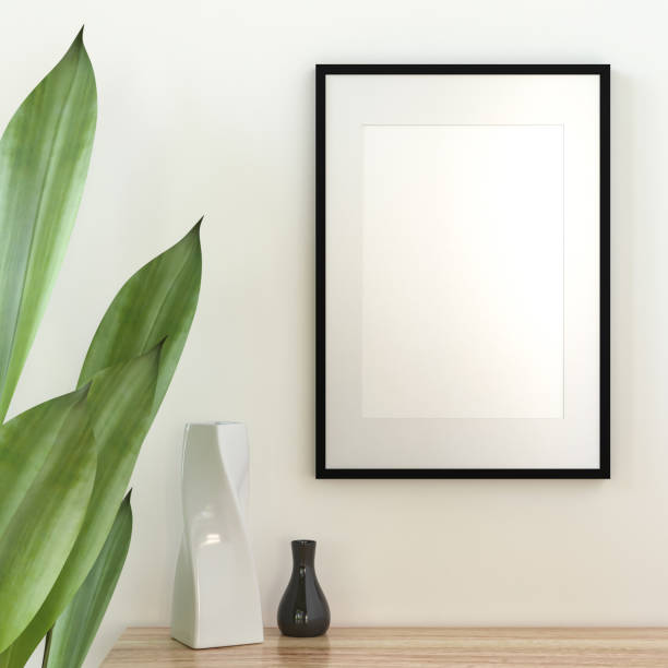 istock Picture frame mounted on the wall with flower vase 1438804040