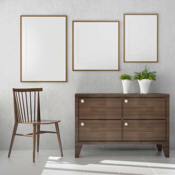 istock Picture frame attached to the wall, with chairs and vases placed on the table. 1438804086