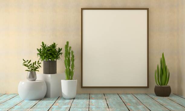 istock Picture frame mounted on the wall with flower vase 1438804162
