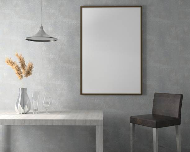 istock Picture frame attached to the wall, with chairs and vases placed on the table. 1438805421