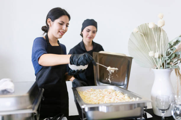 istock Cooks adding cheese to food 1438808776