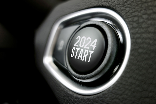 Start stop push button with “2024 start” text