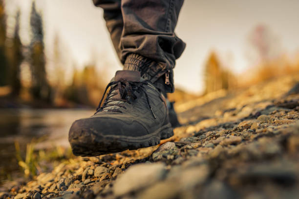 istock men's footsteps on the beach of river 1438812867