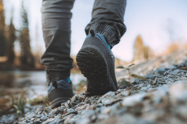 istock men's footsteps on the beach of river 1438812868