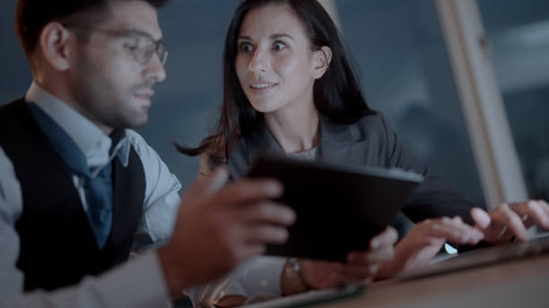 istock Employees working overtime in the company 1438815561