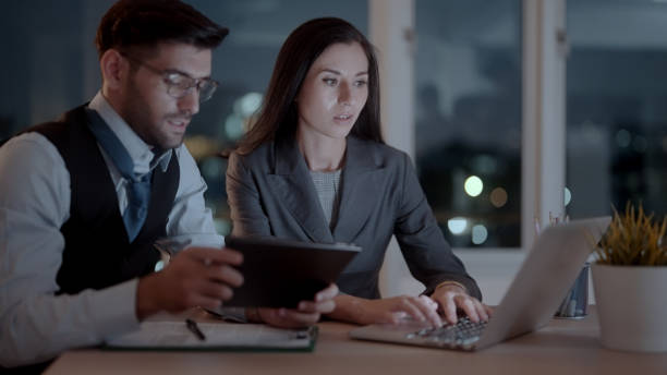 istock Employees working overtime in the company 1438815690