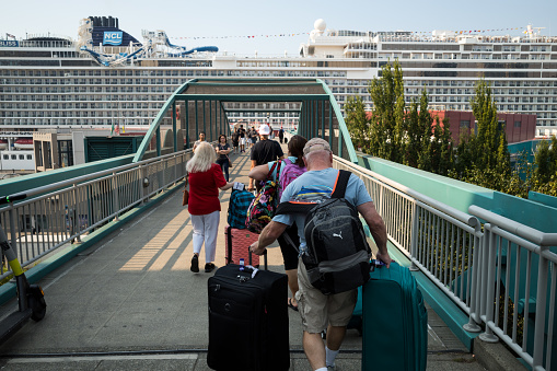 Seattle, USA - Sep 10th, 2022: Cruise ship passengers headed to pier 66 late in the day.