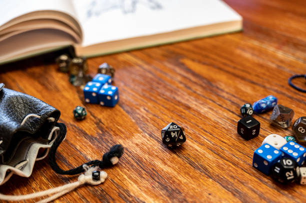 istock Multiple gaming dice on wooden table used for role playing adventures. 1438817982