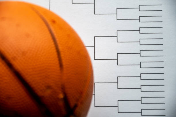 istock Blank bracket grid on white paper with basketball on top 1438818055
