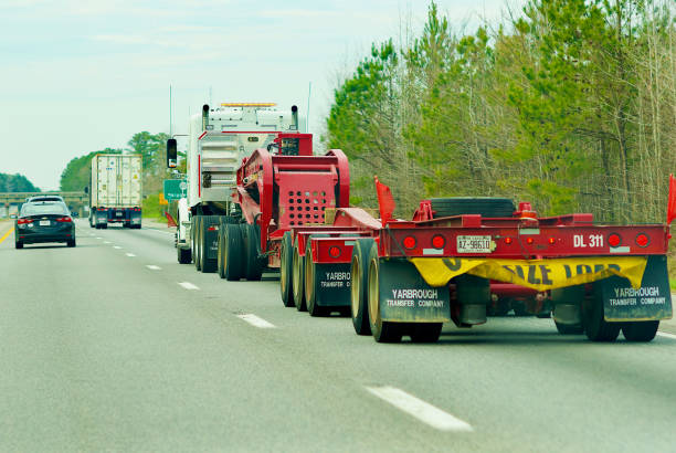 Skippers, Virginia, USA - April 2, 2018: An “Oversized Load” sign on the back of a truck warns drivers on Interstate 95 of an oversized vehicle traveling on the highway.