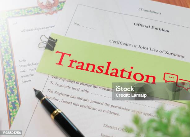 Translation Text Over English Official Translation Paperwork Stock Photo - Download Image Now