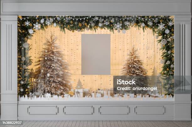 Store Window Display With Christmas Tree Ornaments Gift Boxes And Blank Poster Stock Photo - Download Image Now