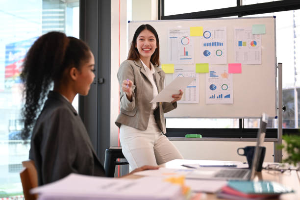 istock Group of start up business people brainstorming, collaborating on project development in corporate office. 1438824458