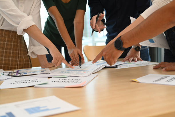 istock Group of start up business people brainstorming, collaborating on project development in corporate office. 1438824477