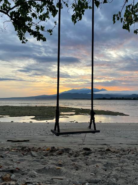 istock Swing on the Sunrise beach 1438826130