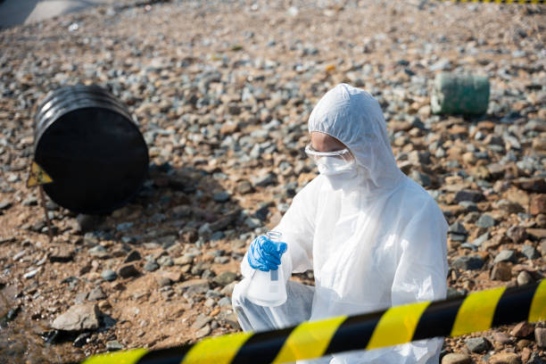 istock Ecologist sampling water from river with test tube glass and have white smoke 1438831143