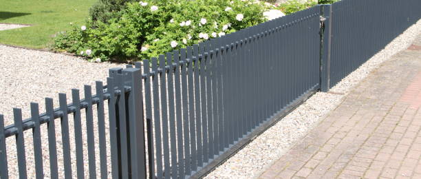istock a driveway with a gray sliding gate 1438833946