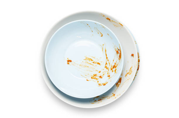 istock Dirty plates with leftover sauce. Isolated on a white background. 1438834493