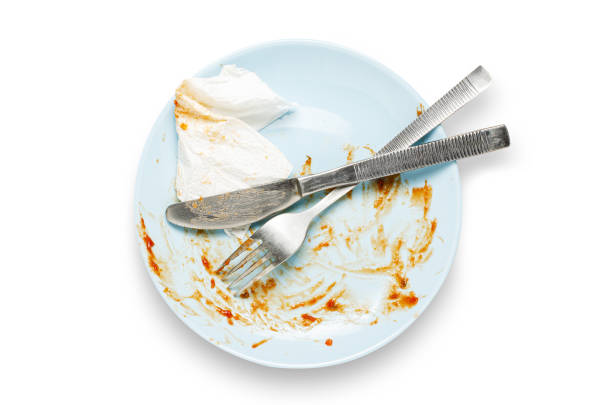 istock A dirty plate with leftover sauce. Isolated on a white background. 1438834503