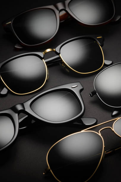istock Collection of sunglasses on dark black background. 1438835262