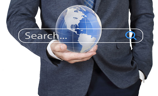 Businessman holding world globe with internet search page of the Search Browsing ,Networking Concept.SEO Search engine optimization concept