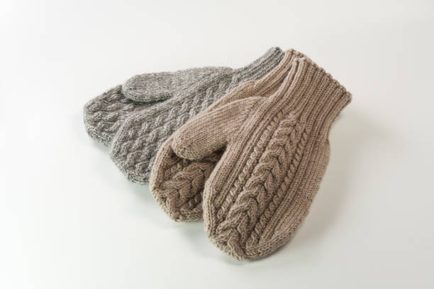 istock Winter woolen mittens with a pattern isolated on a white background. Winter accessory. 1438835655