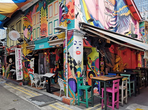 Colourful bar in Haji Lane, in the Kampong Glam neighbourhood of Singapore, a street with many cafes and shops.