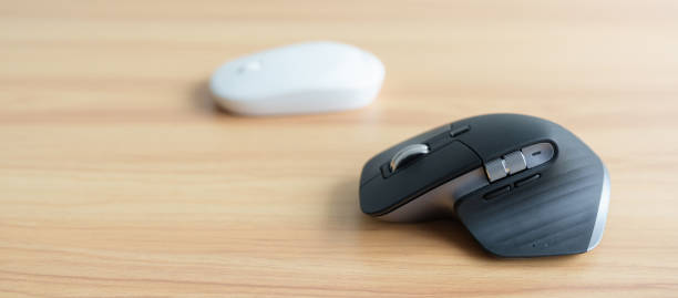 istock Comparison of Ergonomic vertical mouse and general mouse on desk at workplace, prevention wrist pain. De Quervain s tenosynovitis, Intersection Symptom, Carpal Tunnel or Office syndrome concept 1438845088