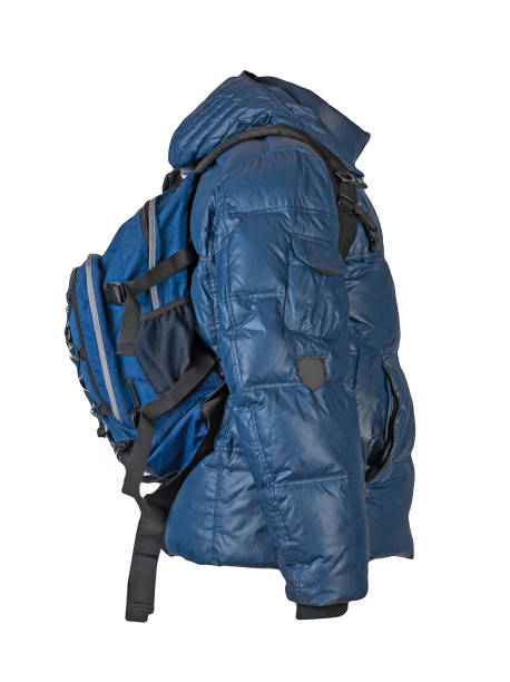 istock black backpack dressed in a red jacket isolated on a white background. 1438845371