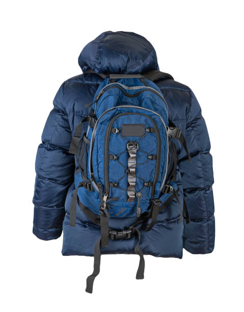 istock black backpack dressed in a red jacket isolated on a white background. 1438845378