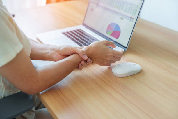 istock Woman having wrist pain when using mouse during working long time on workplace. De Quervain s tenosynovitis, Intersection Symptom, Carpal Tunnel Syndrome or Office syndrome concept 1438845705