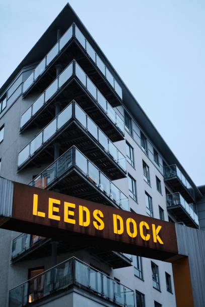 vertical shot of a leeds dock sign lite up - leeds england yorkshire canal museum imagens e fotografias de stock