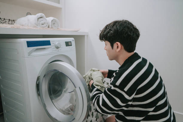 istock Chinese Gay man doing laundry at home 1438848996