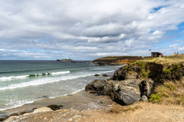 istock rocky Cornwall coast with the Godrevy Lighthouse behind 1438851069
