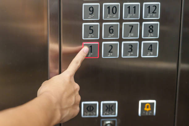 istock Hand finger press the Elevator button, woman using Elevator in office or apartment 1438853486