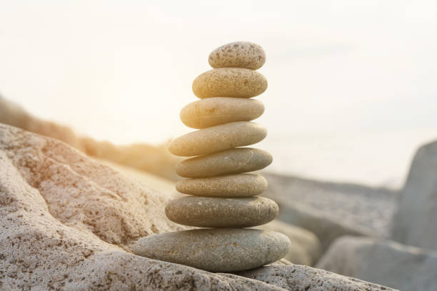 istock Pyramid stones balance on the beach in the sun. 1438854634