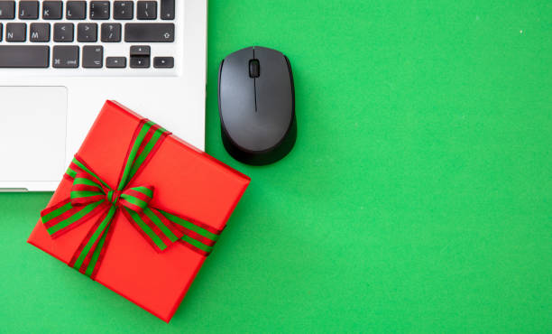 istock Cyber Monday Sale. Gift box and computer laptop, copy space, overhead 1438854855