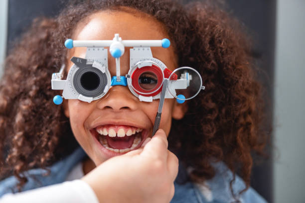 istock Young Girl Wearing Phoropter 1438856927