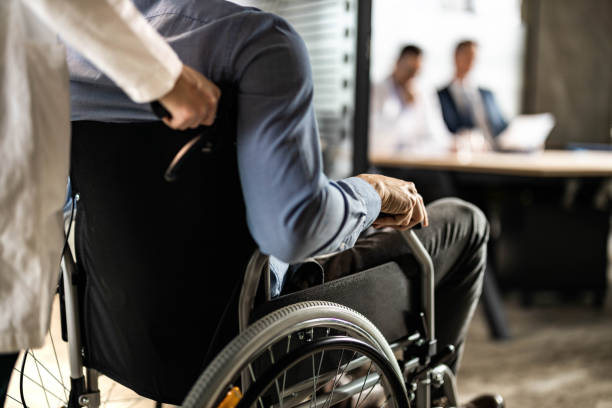 istock Assistance for a disabled businessman! 1438858164