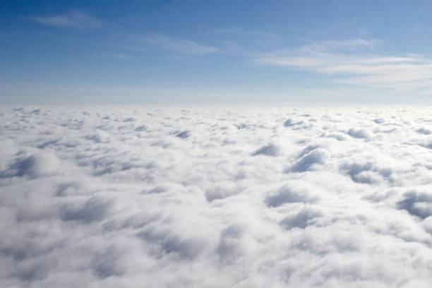 istock View from a plane on a closed cloud cover, a third of sky 1438860399