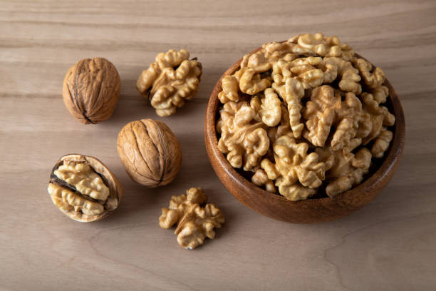 istock Group of peeled walnuts and whole walnuts,directly above 1438860621