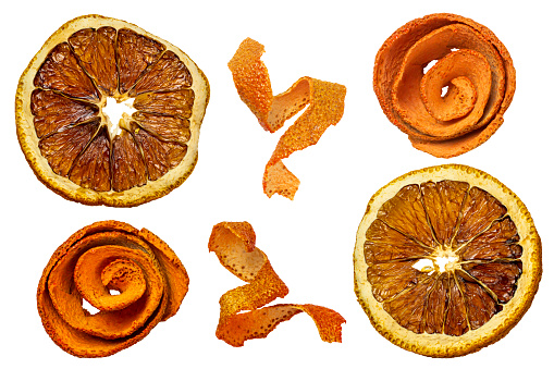 Dried orange fruit chips isolated on white background