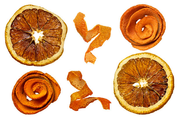 Dried orange slices and orange peel isolated on white background stock photo