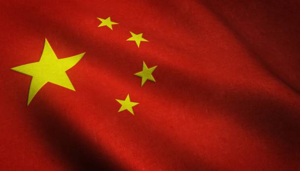 scatto realistico della bandiera sventolante della cina con trame interessanti - chinese flag foto e immagini stock