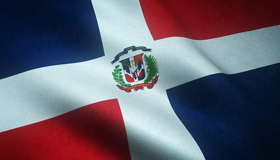 A closeup shot of the waving flag of Dominican Republic with interesting textures