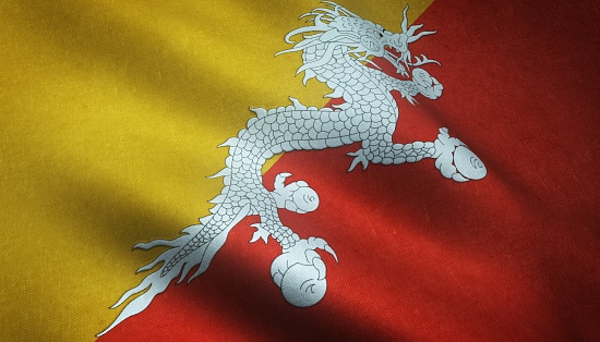 A closeup shot of the waving flag of Bhutan with interesting textures