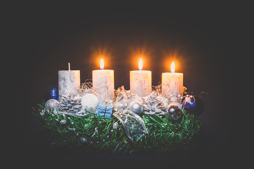 advent concept with three glowing burning candle