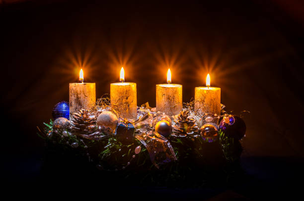 golden advent candles burning religious concept stock photo