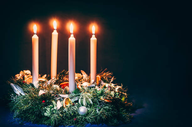golden advent candles burning religious concept stock photo